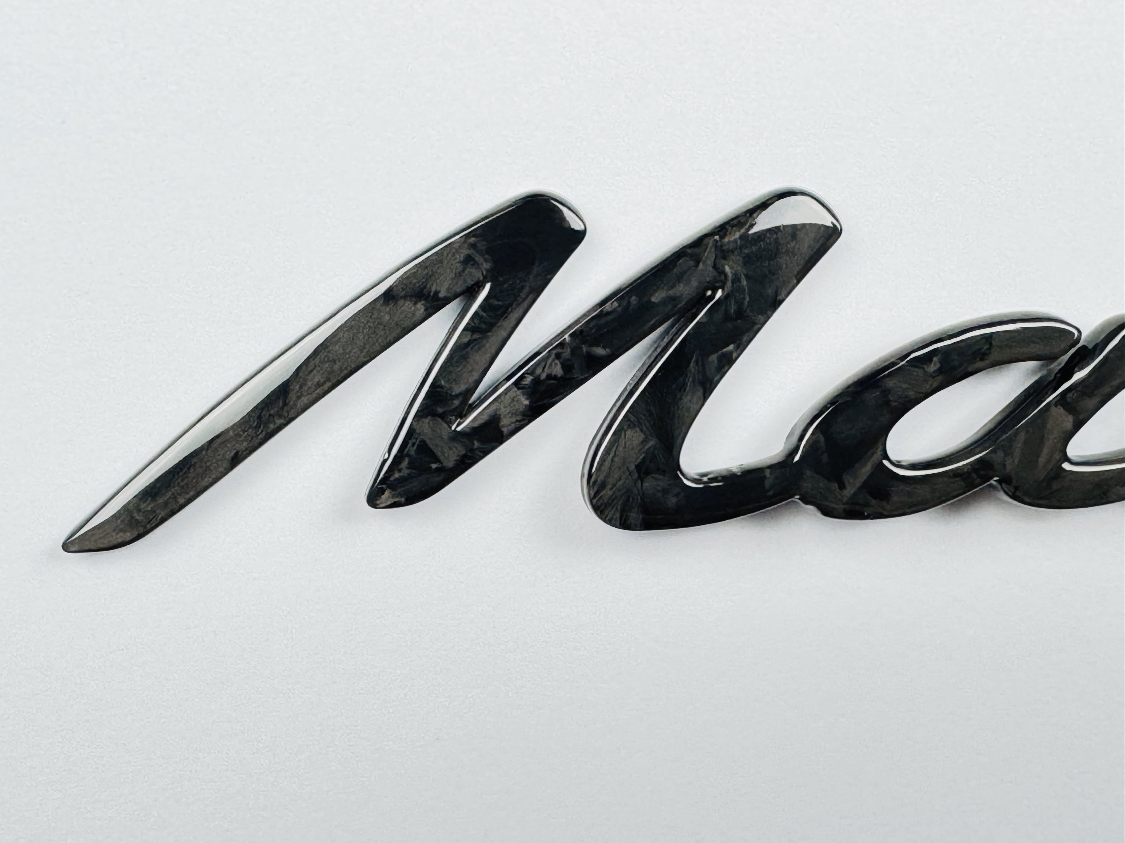 "Macan" Carbon badge