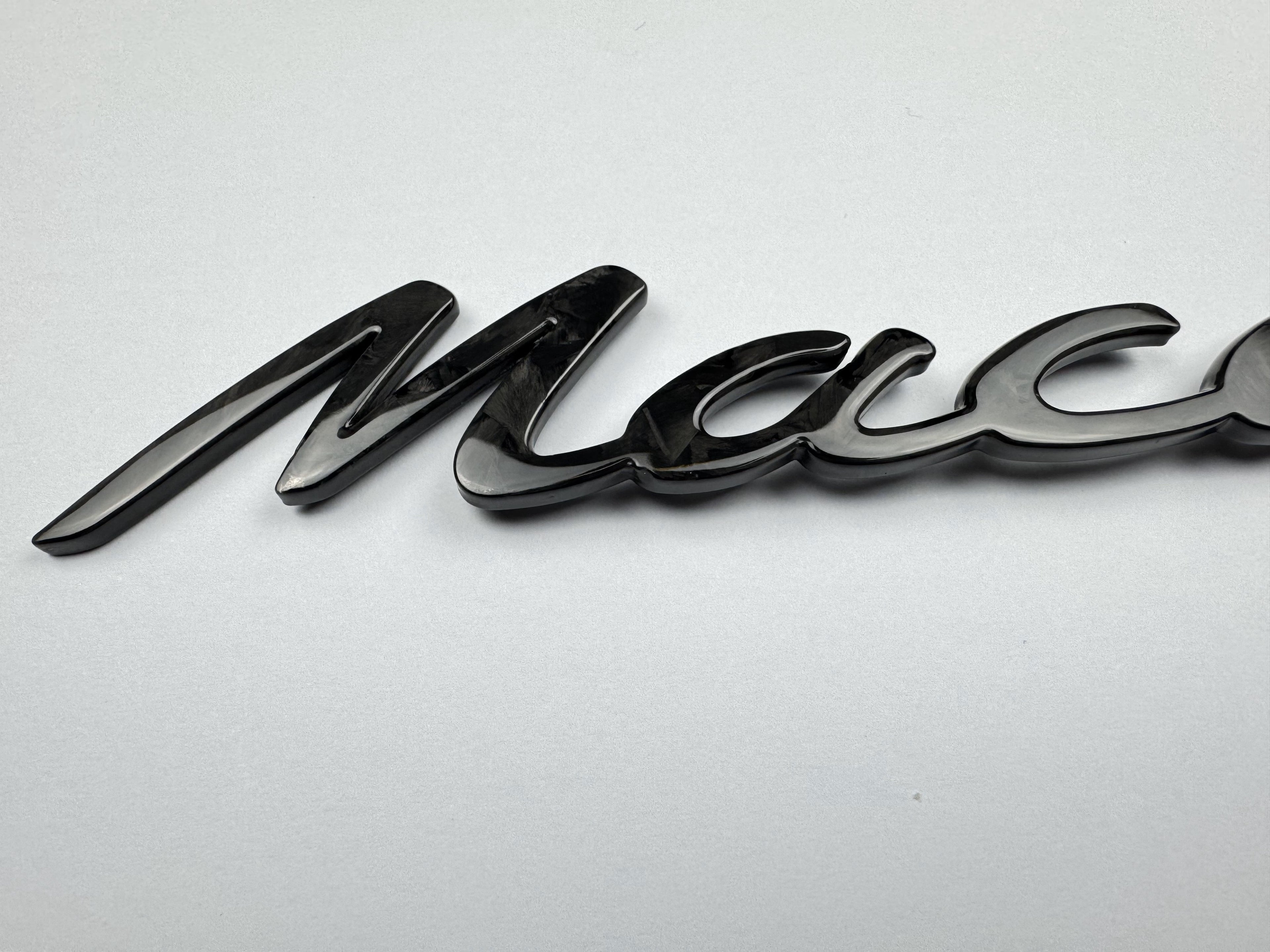 "Macan" Carbon badge